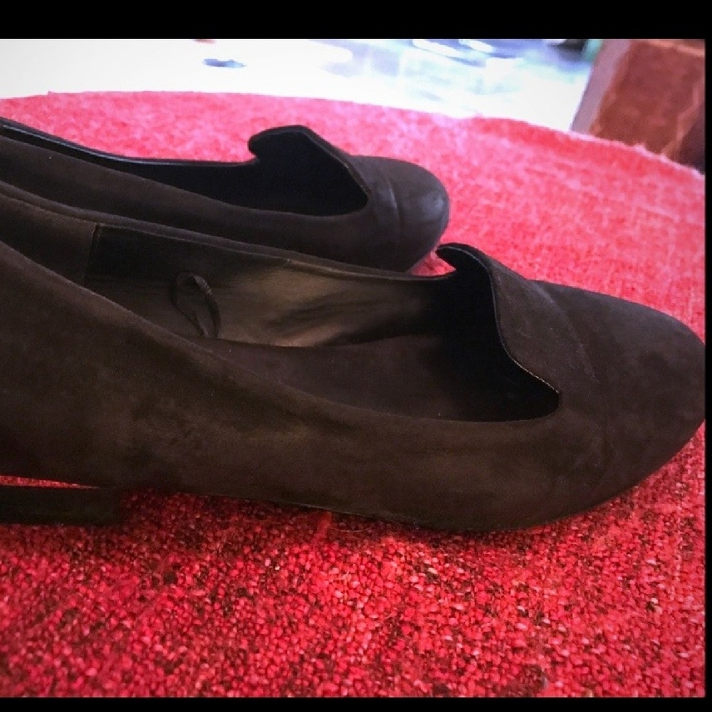 Black flat loafers.